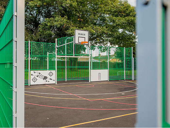 entrance to the multi-use games area court with green panels